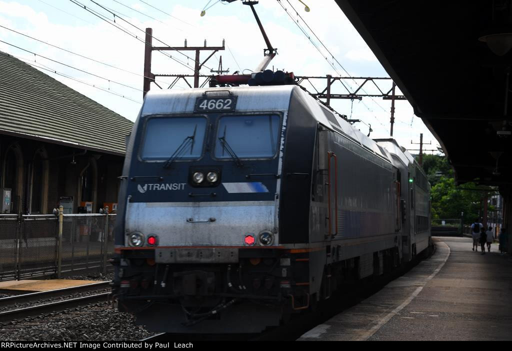 Outbound commuter shoves out of the station